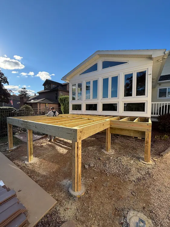 Before: Ground preparation and framing for new porch