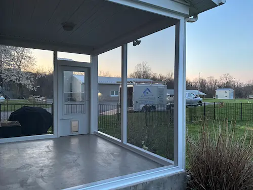 After: Custom-framed screened porch featuring the ScreenEze system and a built-in pet door
